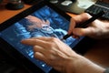 Close up of a Graphic Designer hand drawing on a digital tablet