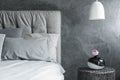 Close-up, gray bed, textured wall