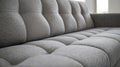 Close-Up Of A Gray Button-Tufted Sofa, Showcasing Its Soft Texture And Modern Design. The Image Evokes A Feeling Of Comfort And Royalty Free Stock Photo