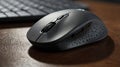 Close up of a gray computer mouse with a keyboard in the background Royalty Free Stock Photo