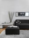 Close up of a gray footrest and sofa in the modern living room