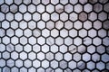 Close up of gray honeycomb, hexagon ceramic tile pattern wall