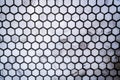 Close up of gray honeycomb, hexagon ceramic tile pattern wall