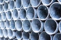 Close up of metal pipes pile. Industrial background.