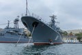 Close-up of the gray ships of the Russian Navy, anchored in the port of Sevastopol. The gray sky in the background.