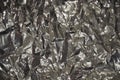 Close-up of gray textured aluminum foil.