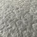 Close-up of a gray, textured surface resembling felt or wool. The material appears soft Royalty Free Stock Photo