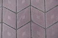 Close up of grayish pink diamond-shaped concrete pavement with geometric pattern Royalty Free Stock Photo