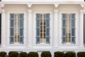 close-up of a greek revival homes symmetrical windows