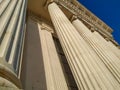 Close up of Greek style pillars and columns old fashioned style historical white architecture building