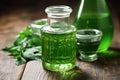 close-up of green absinthe in a glass jar