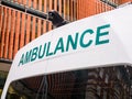 Close-up of green ambulance vehicle sign.