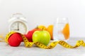 Close up green apple and dumbbell. Healthy snack for diet planning. Royalty Free Stock Photo