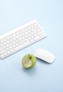 Close up green apple and keyboard