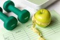 Close up green apple with measuring tape. Diet Health Plan. Nutrition start up workout planning.