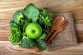 close up green apple with mixed green vegetable in basket and w Royalty Free Stock Photo