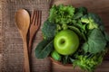 close up green apple with mixed green vegetable in a basket and Royalty Free Stock Photo