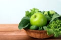 close up green apple with mixed green vegetable in basket and Royalty Free Stock Photo