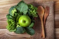 close up green apple with mixed green vegetable in a basket and Royalty Free Stock Photo