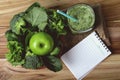 Close up green apple with mixed green vegetable and green juice in a basket and wooden fork and spoon for healthy organic green Royalty Free Stock Photo