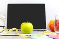 Close up green apple and tape measure. Healthy snack for diet planning for working in office. Royalty Free Stock Photo