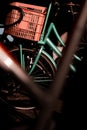 Close-up of a Green bicycle with a pink crate. Royalty Free Stock Photo