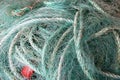 Close up of green blue turquoise rope and fishing nets used for fishing or sailing, Norway Royalty Free Stock Photo