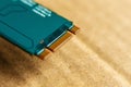 Close-up of the green board's gold-plated edge connector, essential for data transfer in electronics. Royalty Free Stock Photo