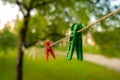 Close up of green clothespin. Drying clothes outdoors. Royalty Free Stock Photo