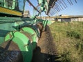 Close-up of a green combine harvester auger. Agricultural machinery