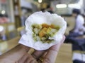 Close up Green Curry Filling of White Steamed Buns in Hand on Blurred background Royalty Free Stock Photo