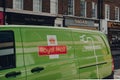 Close up of green electric Royal Mail van on a street in London, UK