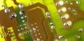 Close up of green electronic computer circuit board as background Royalty Free Stock Photo