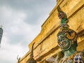 Close up Green Giant Lift golden Pagoda in Wat Phrakaew temple Bangkok Thailand.