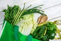 Close up a green grocery bag of mixed organic green vegetables on white , healthy organic green food shopping and diet healthcare Royalty Free Stock Photo
