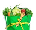 close up a green grocery bag of mixed organic green vegetables on white , healthy organic green food shopping and diet healthcare