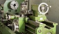Close up green lathe machine in factory Royalty Free Stock Photo