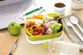 Close up green Lunch box on the work place of working desk , Royalty Free Stock Photo