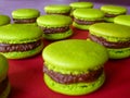 Close up of green macarons prepared for sale in the bakery shop.