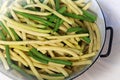 Close up of green and yellow beans in a colander Royalty Free Stock Photo