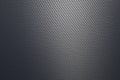 Close up of grey diagonal oriented woven carbon fibre sheet surface. Royalty Free Stock Photo