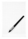 Grid Notebook Page with Pen Lying on Top Royalty Free Stock Photo