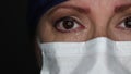 Close-up of Grief Stricken Tearful Doctor or Nurse Wearing Medical Face Mask