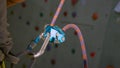 CLOSE UP: Grigri belaying device as belayer assists climber during their ascent