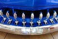 Close Up of Grill on Front of Blue Low Rider Car at Car Show Royalty Free Stock Photo