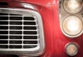 Close Up of Grille and Headlights of Red Vehicle Royalty Free Stock Photo