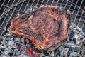Close-up of a grilled beef rib on a barbecue grill Royalty Free Stock Photo