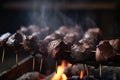 close-up of grilled beef shishkabob, with sizzling and smoke