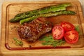 Close up grilled beef steak on wooden board Royalty Free Stock Photo