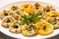 close-up of grilled calamari rings with capers Royalty Free Stock Photo